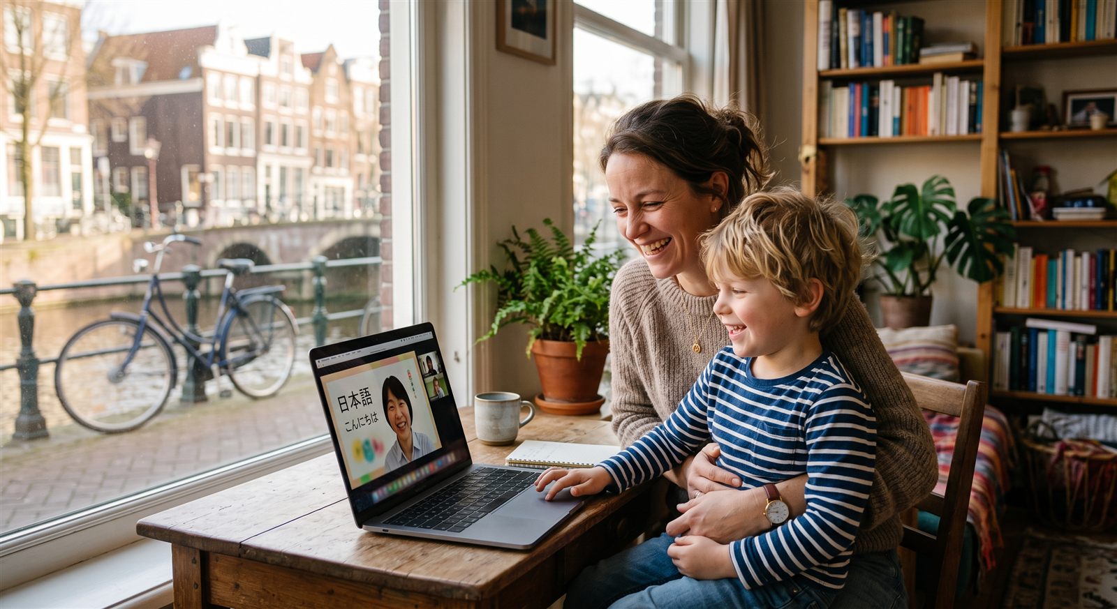 A Vancouver parent and child at a laptop during a weekend online Japanese lesson